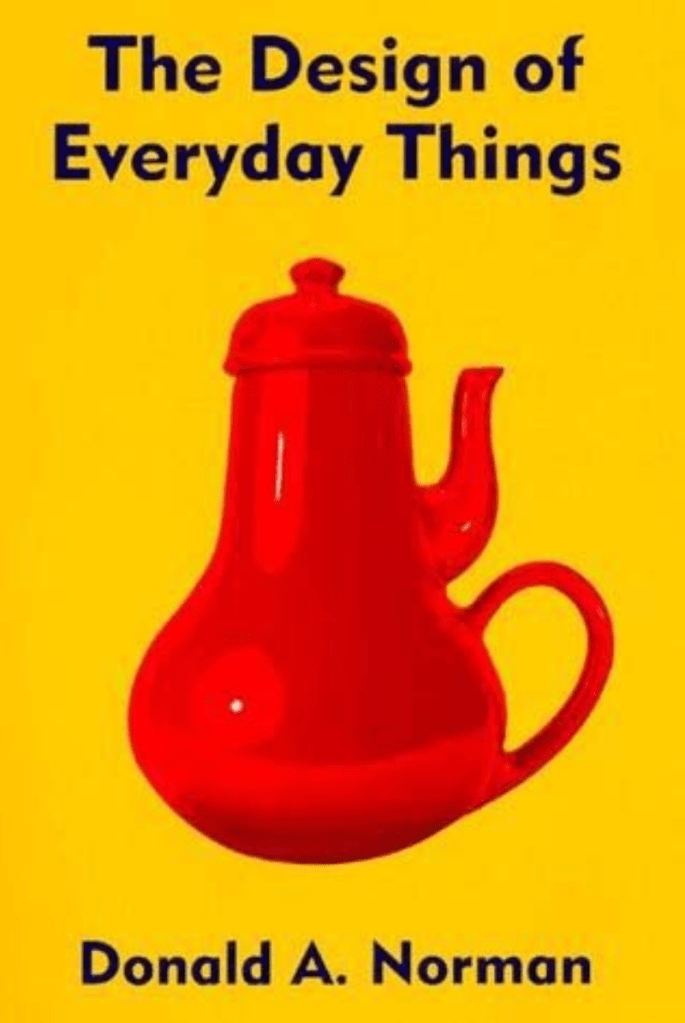 Yellow book cover with red coffee pot designed in a way that cannot ever work, in red
