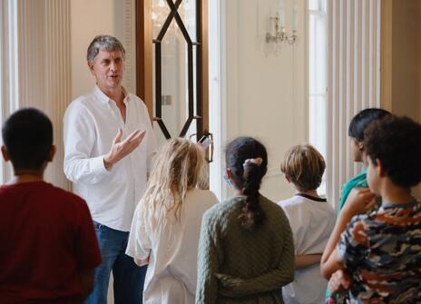 Paul Curzon at the Royal Institution, entertaining some children with the magic of computer science