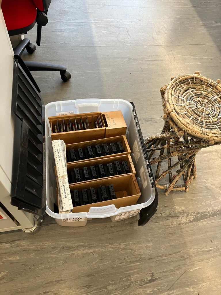 A close up of one of the kit boxes and the newspaper chair.