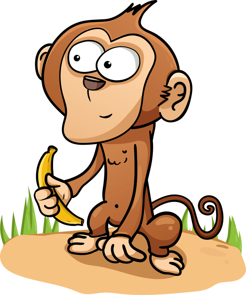A monkey holding a banana.