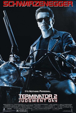 A poster showing Arnold Schwarzenegger in character for Terminator 2. He's dressed in black leather, wearing sunglasses, sitting on a motorbike and holding a large gun.